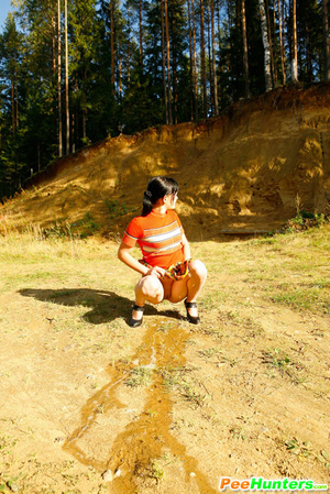 Cute tart walking down the hill squats down to pee - Picture 12