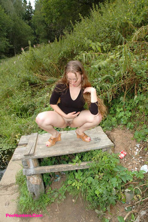 Dirty teen slut sits for a piss on a picnic table - Picture 7