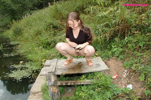 Dirty teen slut sits for a piss on a picnic table - Picture 14