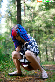 Young cutie empties her bladder in the forest