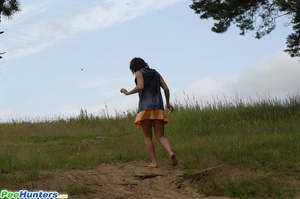 Naughty brunette pisses into a sandpit in forest - XXXonXXX - Pic 16