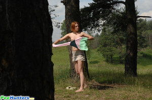 Redhead pissing in the forest under the tree - Picture 14