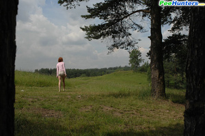 Redhead pissing in the forest under the tree - Picture 16