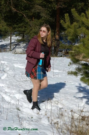 Teen peeing in the snow forest - Picture 1