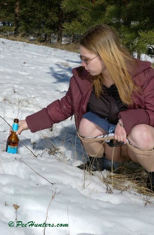 Teen peeing in the snow forest - Picture 12