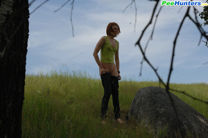 Babe tinkles on a rock in the middle of a field - XXXonXXX - Pic 11