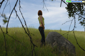Girlie takes a leak sitting on top of a huge rock - XXXonXXX - Pic 4