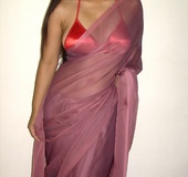 Gorgeous indian babe in sexy red bra teasingly dancing on a cam.