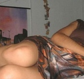 Stunning indian brunette posing on the bed in her sexy black lingerie.