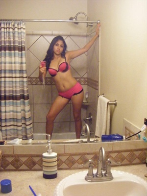 Delicious indian cutie taking off her pink undies and flashing her twat in the bath tub. - Picture 1