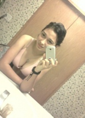 Smily indian stunner in sexy red dress seductively posing in the restroom. - Picture 10
