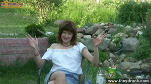 Brunette mature slut takes off white blouse and skirt and posing stark-naked in the garden - Picture 4