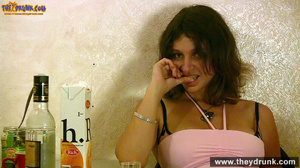Relaxed slut in top and miniskirt sits in the corner then on the top of the table - Picture 9