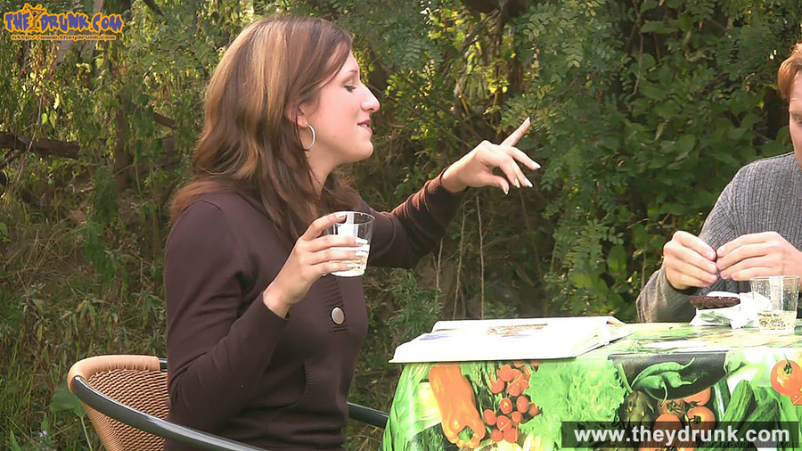 Brunette in purple blouse gets relaxed and topless in the garden and takes out her man's cock for a blowjob - XXXonXXX - Pic 4