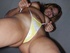 Spunky, cute, young Prinzzess models panties with a grin as she tells
