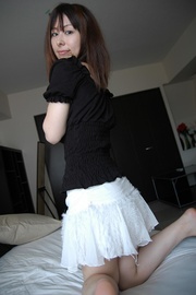 Brunette asian milf taking off her white skirt and black lingerie before getting it on with lucky stranger.
