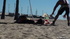 lying the beach her
