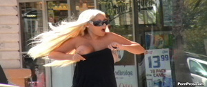 Dropped boobs out of black dress violently, having committed a public nudity act - Picture 12