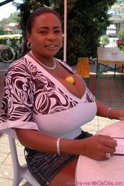 Black lovely bimbo wearing tight t-shirts outdoors so you can check out her huge juggs.
