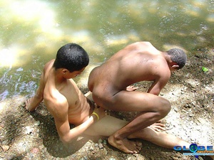 Two cute gay anal blacks fooling around on the river bank… - Picture 5