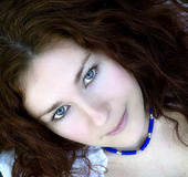 Beautiful redhead hottie strippping off her clothes and swimming in the