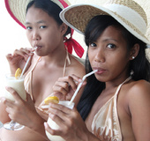 Two tanned Asian lesbians are feasting BD of one of the sluts…