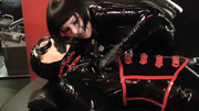 Crazy rubber dressed couple going wild on a cam while in tough bondgae.