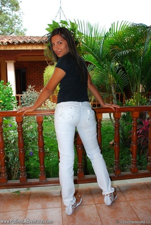 Swarthy girl in white jeans takes them off to rub her lustful slit - Picture 5