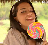 Nasty latina girl with a lollipop undresses to show her sexy body in porn