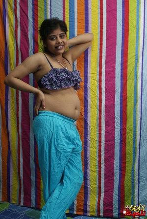 Indian chick in blue national costume and funny lingerie gets nude and poses on cam - Picture 5