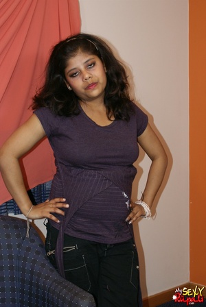 Curly Indian girl in black trousers takes off her clothes to show her big tits - Picture 5