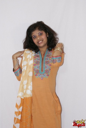 Lewd Indian bitch in orange national costume gets nude to wear her nice lingerie - Picture 3