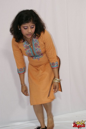 Lewd Indian bitch in orange national costume gets nude to wear her nice lingerie - Picture 6