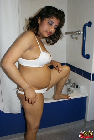 Chubby Indian bitch in white lingerie taking shower in the bathtub - Picture 2