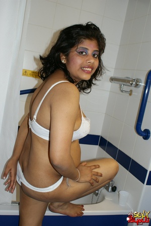 Chubby Indian bitch in white lingerie taking shower in the bathtub - Picture 3