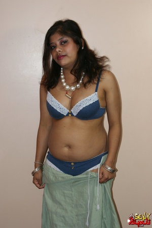 Cool pics with a real Indian girl in a blue sari undresses to expose her chubby delights on cam - Picture 7