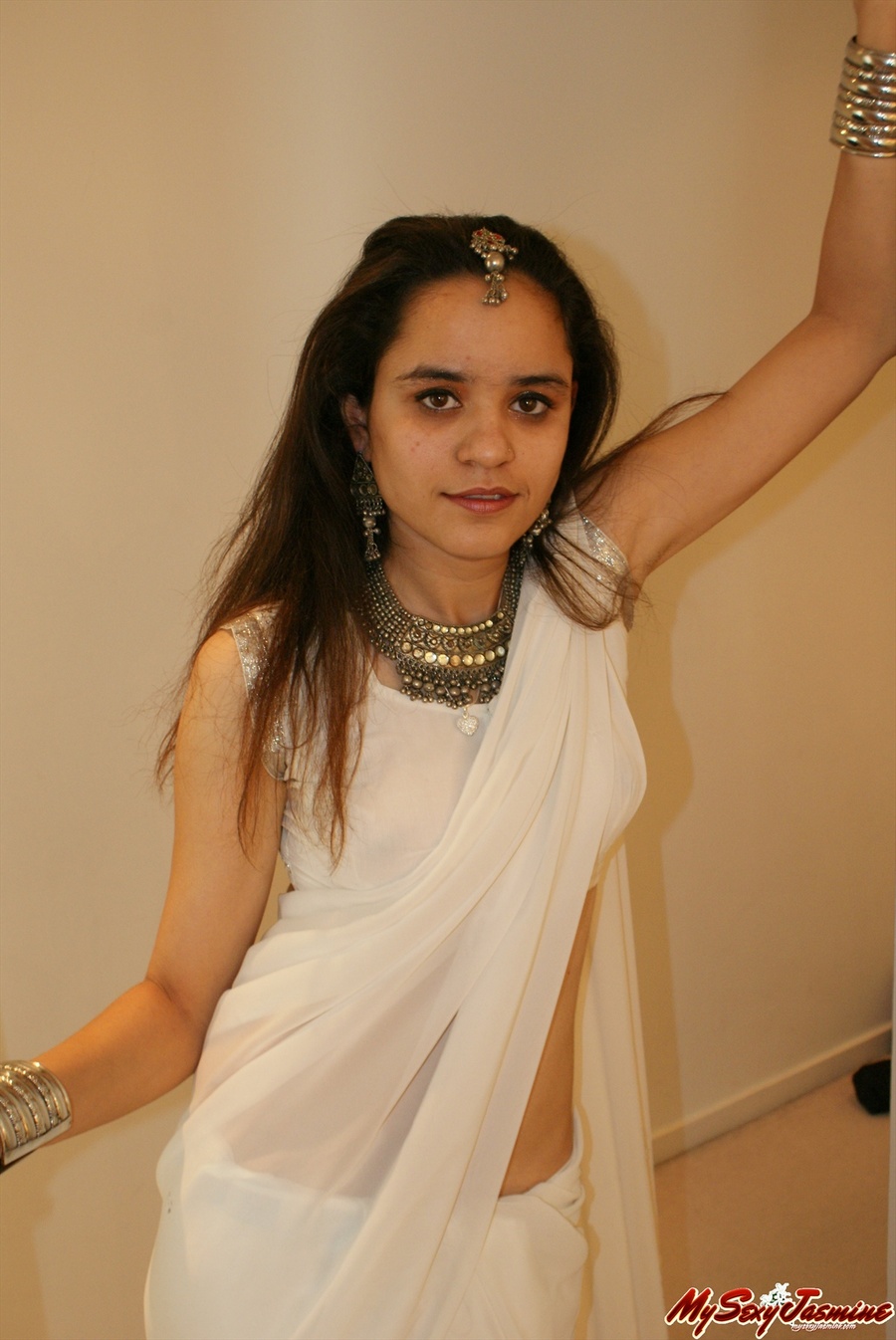 Good-looking Indian chick stripping her white clothes on cam and staying only in blue panties and bracelets - XXXonXXX - Pic 1