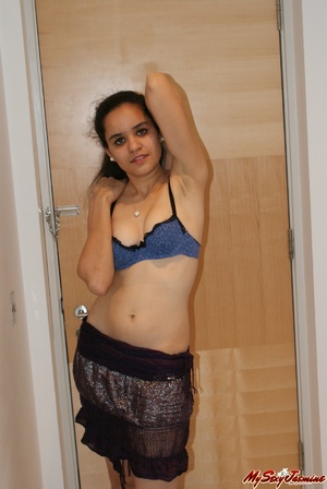 Slutty Indian Jasmine takes off her blue lingerie to expose her small tits on cam - Picture 5