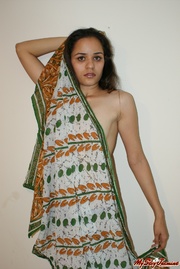 Long-haired Indian chick gets naked to demonstrate her lovely forms in sari