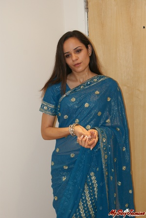 Naughty Indian teen Jasmine in blue sari gets topless to show you her fresh tits - Picture 1