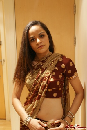 Naughty Indian girl in purple lingerie takes off her nice sari to show you her delights - Picture 2