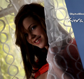 Nice tattooed brunette in a red T-shit stroking her boobs under it and