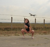 Lovely teen in latex dress with her tits naked shows off her pussy on