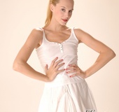 Nice red chick in a white transparent blouse and skirt loves to be in