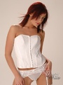 Lovely red chick in a white corset and - Picture 3