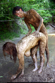 Bodacious photo session of nude guy and a girl in mud