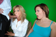Dirty blonde mom in a white blouse giving a teen bitch a master class of cocksucking