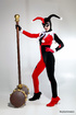 Nasty teen girl in sexy fool's costume with a huge hammer undresses to