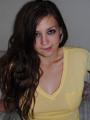 Dirty brunette teen in a yellow T-shirt showing off her - Picture 2