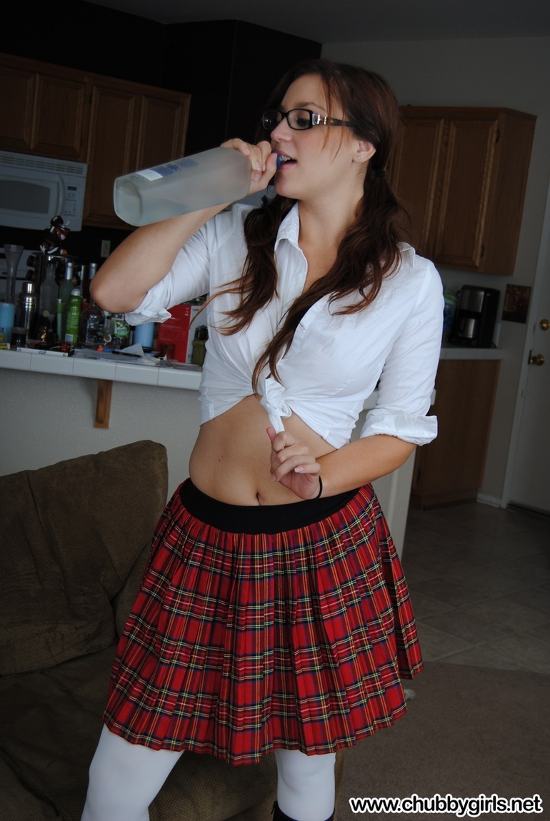 Hot college girl in the uniform and in glasses undresses - Picture 3